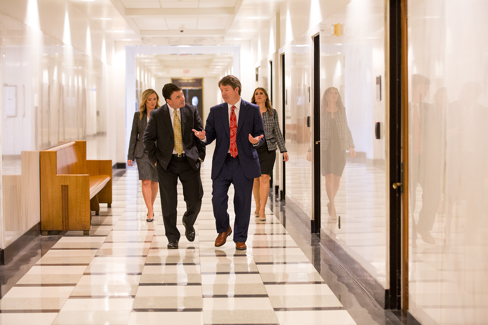 team of frp defective product lawyers in birmingham walking down a hallway
