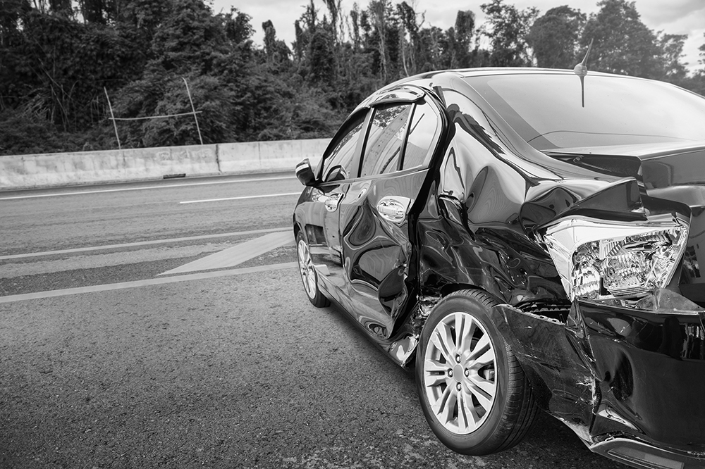 Wrecked car on the side of the road