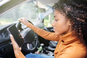 woman on phone driving